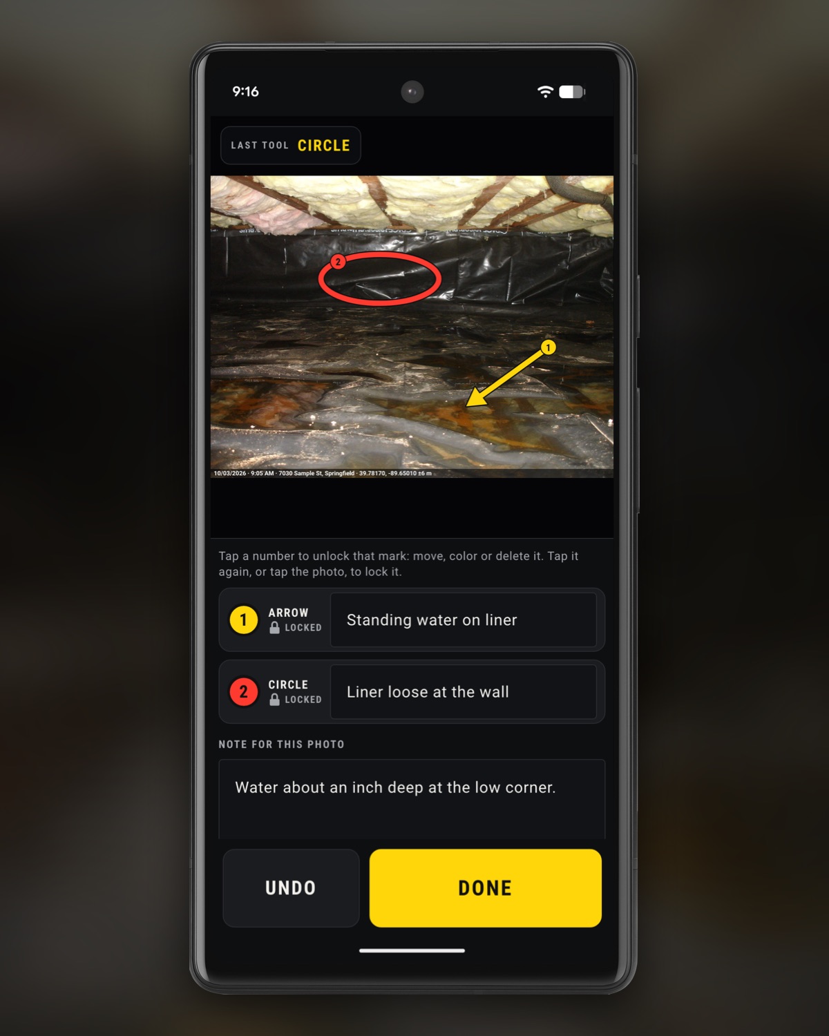 InspectCam Pro’s markup screen on an Android phone: a crawl space photo, stamped along its bottom edge with the date, time, address and GPS position, with a yellow arrow numbered 1 pointing at water pooled on the plastic vapor barrier and a red circle numbered 2 around the liner at the wall. Under the photo, a row for each mark with its words, Standing water on liner and Liner loose at the wall, then the note for the photo, and big Undo and Done buttons.