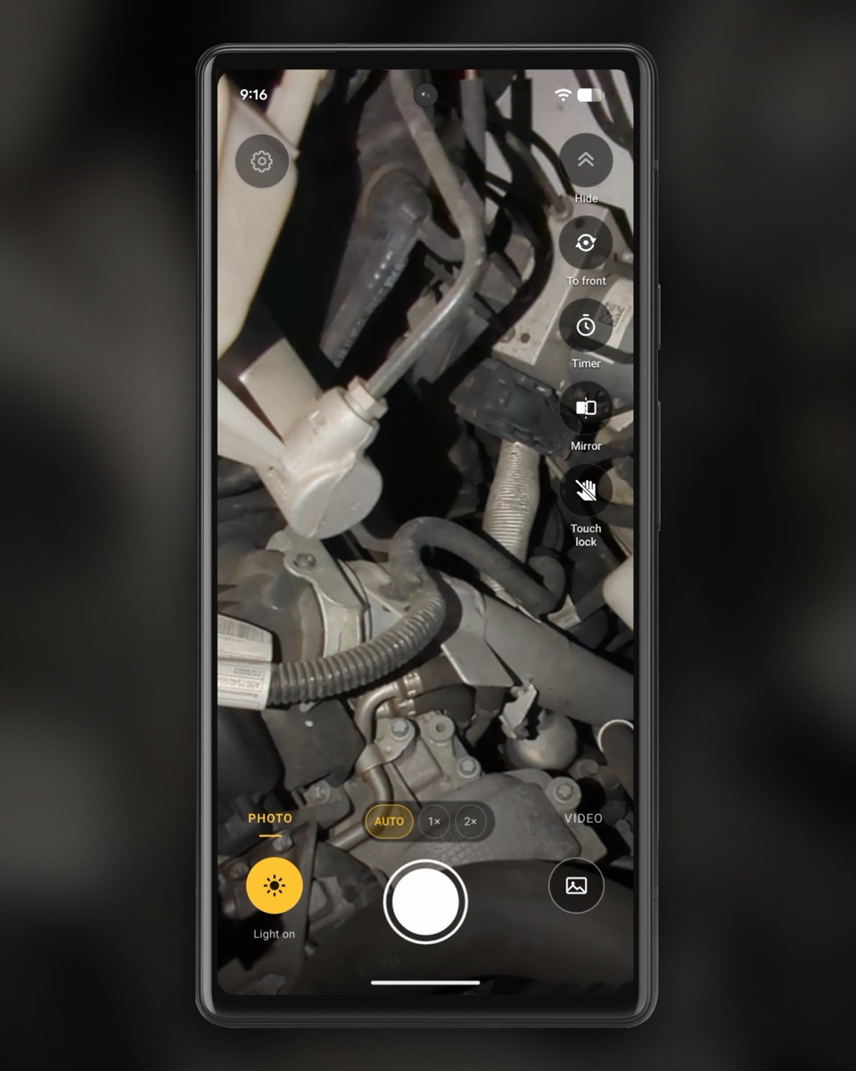 InspectCam’s camera in an engine bay, light on.