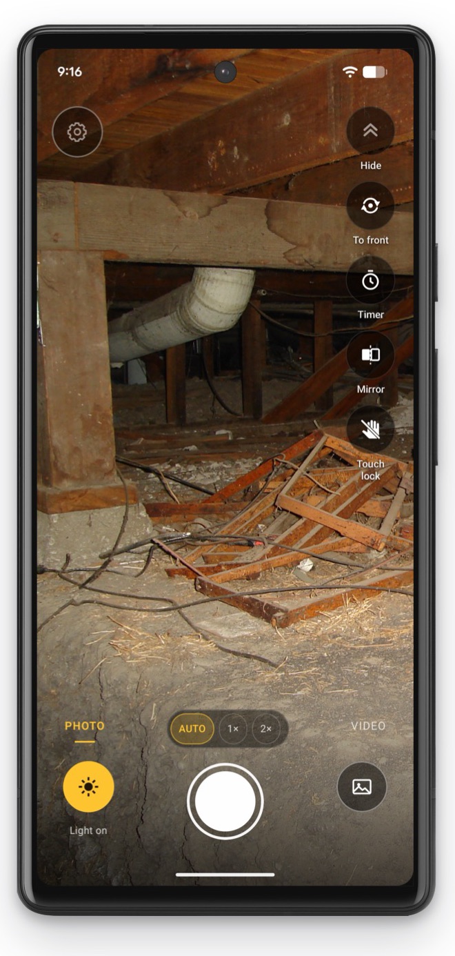 InspectCam’s free camera on a phone in the crawl space under a house.